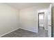 Bright bedroom with carpet flooring and access to a bathroom at 1777 W Austin Rd, Decatur, GA 30032