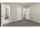Bedroom with carpet flooring and multiple doors at 1777 W Austin Rd, Decatur, GA 30032