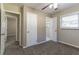 Well-lit bedroom with carpet flooring and multiple closets at 1777 W Austin Rd, Decatur, GA 30032