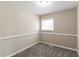 Simple bedroom with neutral walls and carpet at 1777 W Austin Rd, Decatur, GA 30032