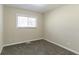 Simple bedroom with neutral walls and carpet at 1777 W Austin Rd, Decatur, GA 30032