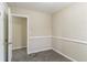 Small bedroom with neutral walls and carpet at 1777 W Austin Rd, Decatur, GA 30032