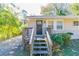 House exterior featuring a dark brown front door and wooden steps leading to a porch at 1777 W Austin Rd, Decatur, GA 30032