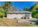 Back exterior view showing a ranch-style home and patio at 1777 W Austin Rd, Decatur, GA 30032
