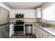 Modern kitchen with stainless steel appliances and granite countertops at 1777 W Austin Rd, Decatur, GA 30032