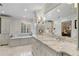 Spa-like bathroom with marble finishes and soaking tub at 3250 Arborwoods Dr, Alpharetta, GA 30022