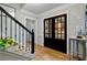 Light and airy entryway with hardwood floors, a staircase, and french doors at 3250 Arborwoods Dr, Alpharetta, GA 30022