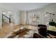 Living room with hardwood floors, large windows, and a view to the entryway at 3250 Arborwoods Dr, Alpharetta, GA 30022