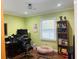 Home office with a large desk, comfortable chair, and bookcase at 2769 Glenwood Se Ave, Atlanta, GA 30317