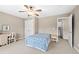 Bright bedroom with double doors leading to the bathroom and a ceiling fan at 2252 Edgartown Se Ln # 2, Smyrna, GA 30080