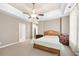 Large bedroom with ceiling fan, plush carpeting, and ensuite bath access at 2252 Edgartown Se Ln # 2, Smyrna, GA 30080