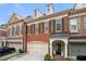 Brick townhouse exterior with two-car garage at 2252 Edgartown Se Ln # 2, Smyrna, GA 30080