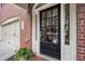 Elegant black front door with glass panels and welcoming entryway at 2252 Edgartown Se Ln # 2, Smyrna, GA 30080