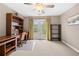 Home office with built-in shelving, desk, and French doors at 2252 Edgartown Se Ln # 2, Smyrna, GA 30080