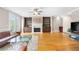 Living room with hardwood floors, fireplace, built-in shelving, and access to balcony at 2252 Edgartown Se Ln # 2, Smyrna, GA 30080