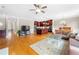 Open-concept living space with hardwood floors, kitchen island, and comfortable seating at 2252 Edgartown Se Ln # 2, Smyrna, GA 30080