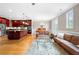 Open concept living area with hardwood floors and access to a balcony at 2252 Edgartown Se Ln # 2, Smyrna, GA 30080