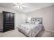 Bedroom with ceiling fan, double closet, and grey carpet at 314 River Glen Dr, Roswell, GA 30075