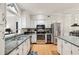 Updated kitchen featuring stainless steel appliances and granite countertops at 314 River Glen Dr, Roswell, GA 30075