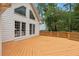 Large deck with a wooden design and access from the house at 10015 Twingate Dr, Alpharetta, GA 30022