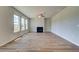 Bright living room featuring a fireplace and hardwood floors at 250 Arnewood Cir, Mcdonough, GA 30253