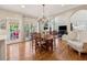 Open concept dining area with hardwood floors and views into the living room and kitchen at 3015 Oaktree Ne Ct, Marietta, GA 30066