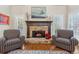 Cozy living room featuring a stone fireplace and comfortable armchairs at 3015 Oaktree Ne Ct, Marietta, GA 30066