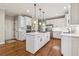 Modern kitchen with white cabinets, quartz countertops, and stainless steel appliances at 3015 Oaktree Ne Ct, Marietta, GA 30066