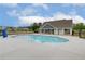 Community pool with a kidney-shaped design and plenty of space for lounging at 565 Teversham Dr, Mcdonough, GA 30253