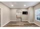 Living room with wood-look floors and an archway to another room at 4055 Butternut, Atlanta, GA 30349