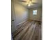 Bright bedroom with vinyl flooring and large window at 4510 Burks Rd, Forest Park, GA 30297