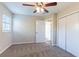 Bright bedroom featuring ceiling fan and double closets at 5847 Lanier Blvd, Norcross, GA 30071