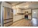 Updated kitchen featuring white shaker cabinets and granite countertops at 4670 Brookwood Dr, Cumming, GA 30041