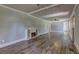 Bright living room featuring hardwood floors and a modern electric fireplace at 4670 Brookwood Dr, Cumming, GA 30041