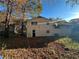 Back of house view, showing a large yard with mature trees at 8423 Avalon Dr, Riverdale, GA 30274