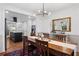 Bright dining room with a wood table, bar cart, and view of the kitchen at 1642 Van Epps Se St, Atlanta, GA 30316