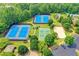 Aerial view of tennis, pickleball and sand volleyball courts at 3565 Hickory Branch Trl, Suwanee, GA 30024