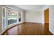 Bright living room featuring hardwood floors and a large bay window at 5438 Chanel Ct, Atlanta, GA 30338