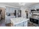 Modern kitchen with stainless steel appliances and island at 180 Thatching Ln, Alpharetta, GA 30022