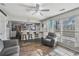 Open living room with kitchen views and hardwood floors at 180 Thatching Ln, Alpharetta, GA 30022