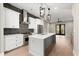 Modern kitchen with white cabinets, gray island, and stainless steel appliances at 2333 Mason Dr # D26, Atlanta, GA 30316