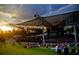 Outdoor amphitheater with a crowd enjoying a concert at sunset at 531 S Main St # 410, Alpharetta, GA 30009