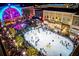 Outdoor ice skating rink with festive holiday lights and surrounding shops at 531 S Main St # 410, Alpharetta, GA 30009