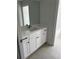 White vanity with quartz countertop, and tile floor at 5439 Beaver Lake Dr, Powder Springs, GA 30127