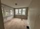 Empty bedroom with hardwood floors and large windows needing renovation at 603 Willard Sw Ave, Atlanta, GA 30310