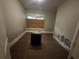 Empty bedroom with hardwood floors and a window at 603 Willard Sw Ave, Atlanta, GA 30310