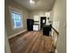 Kitchen with white cabinets and dark appliances at 603 Willard Sw Ave, Atlanta, GA 30310