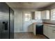 Kitchen with black appliances and white cabinets at 1550 Mayflower Sw Ave, Atlanta, GA 30311