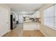 Bright kitchen with granite countertops and white cabinets at 7463 Lerose Dr, Jonesboro, GA 30236