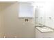 Clean bathroom with granite countertop, sink, and built-in storage at 2363 Dabney Ter, Atlanta, GA 30344
